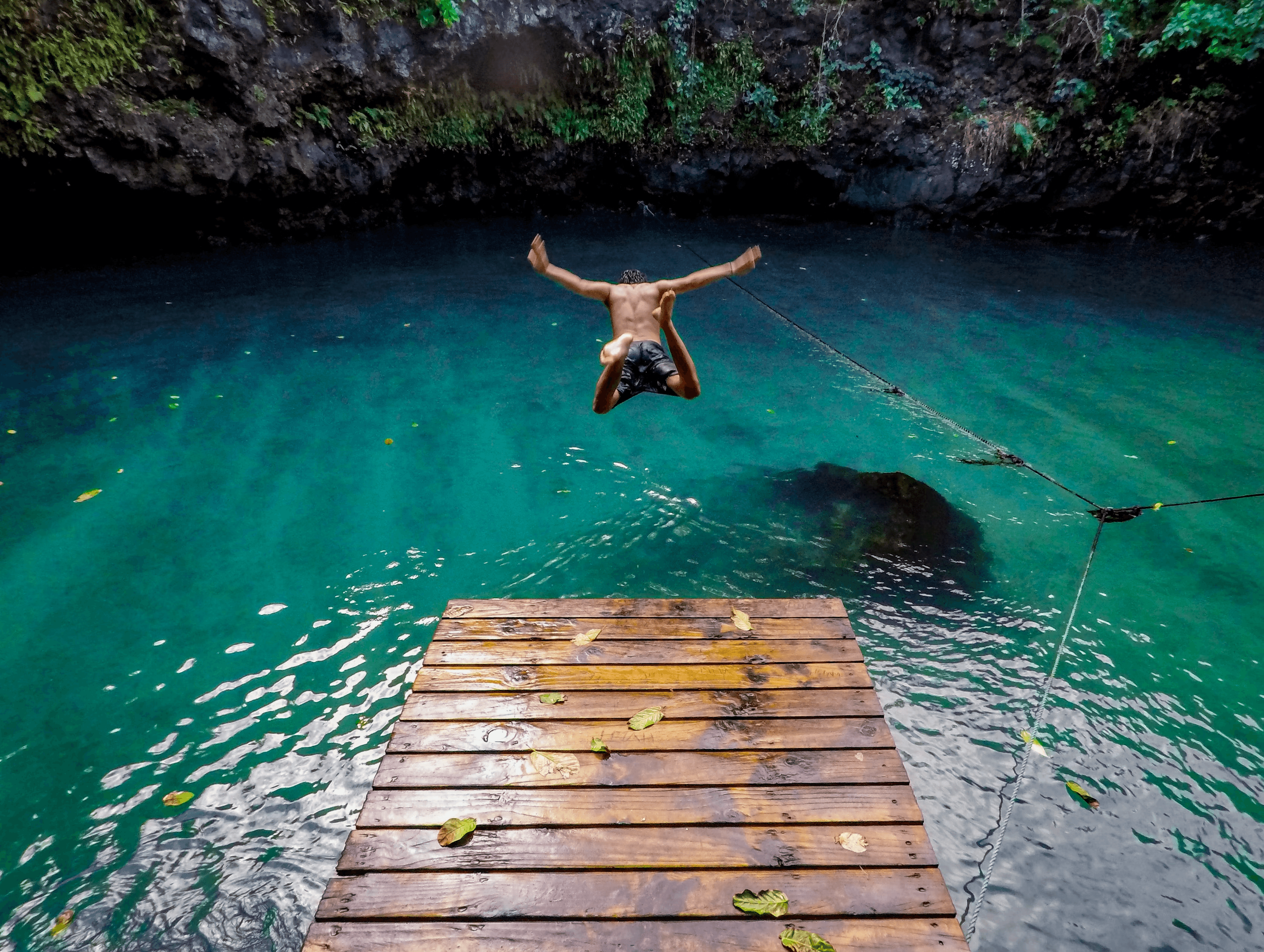 A man jumping into water
